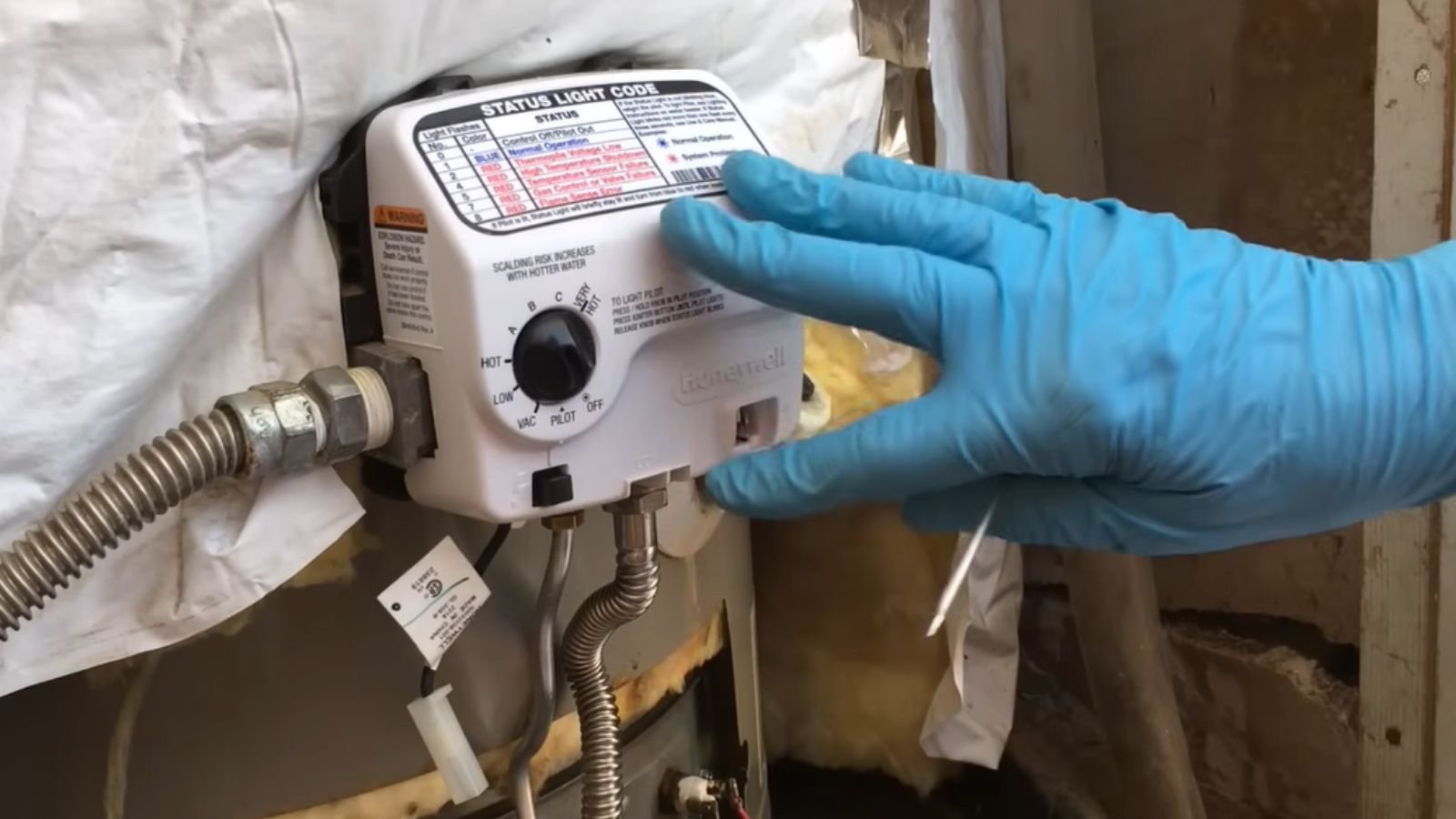 Technician repairing a residential tank water heater